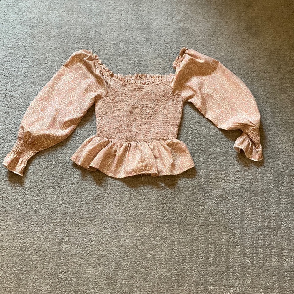 long sleeve flower top that’s tight around the chest